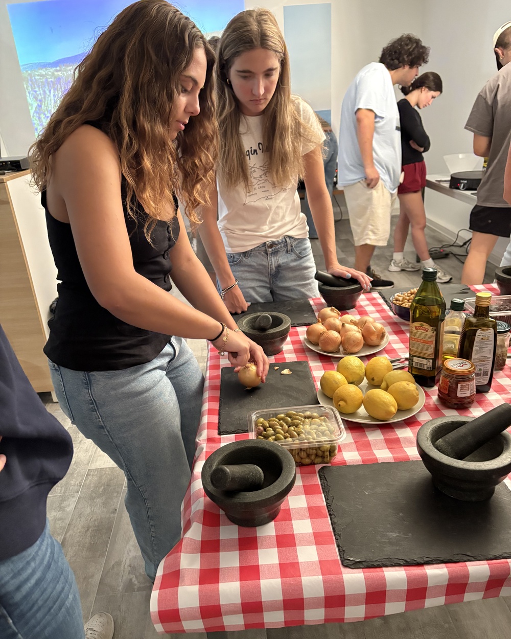 Students preparing ingredients at a French Apéro cooking class